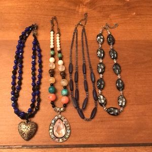 Set of four costume fashion necklaces
